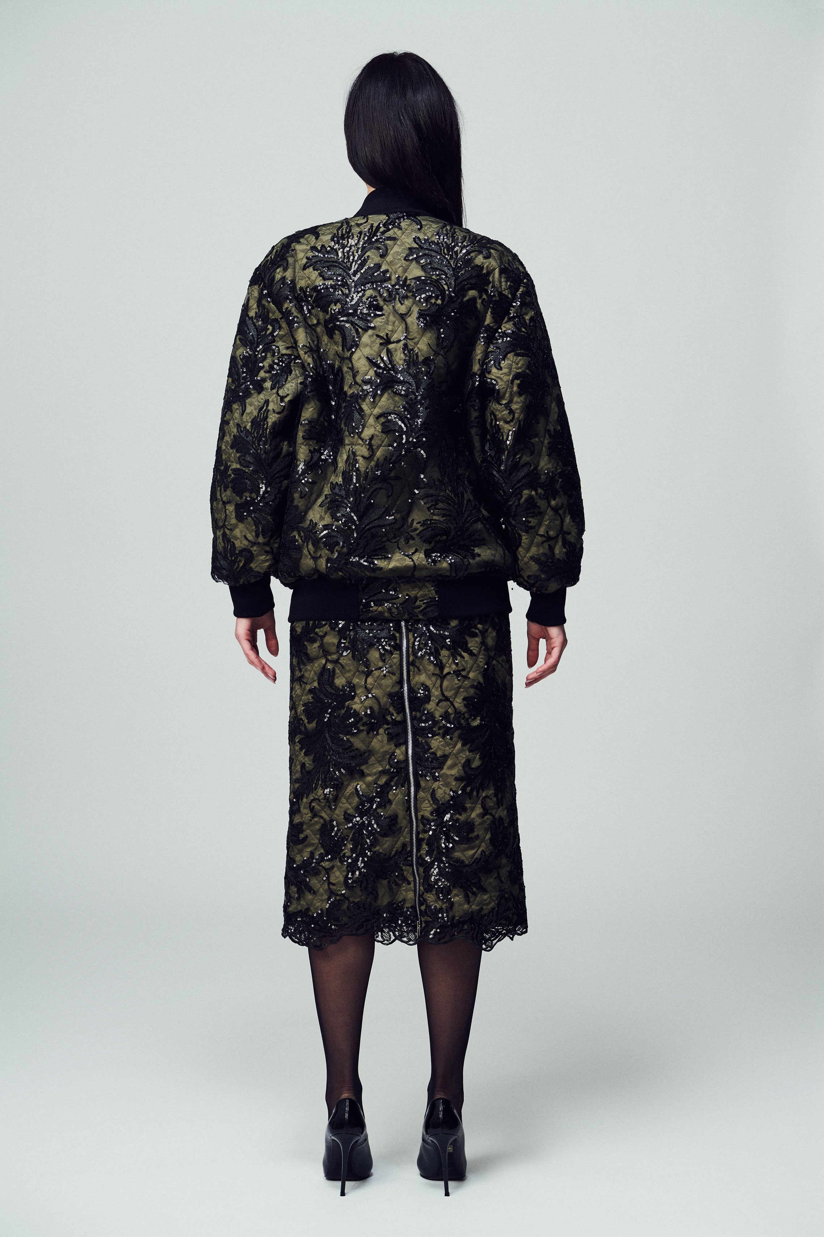 Bomber Belluno in paillettes e pizzo nero con base verde