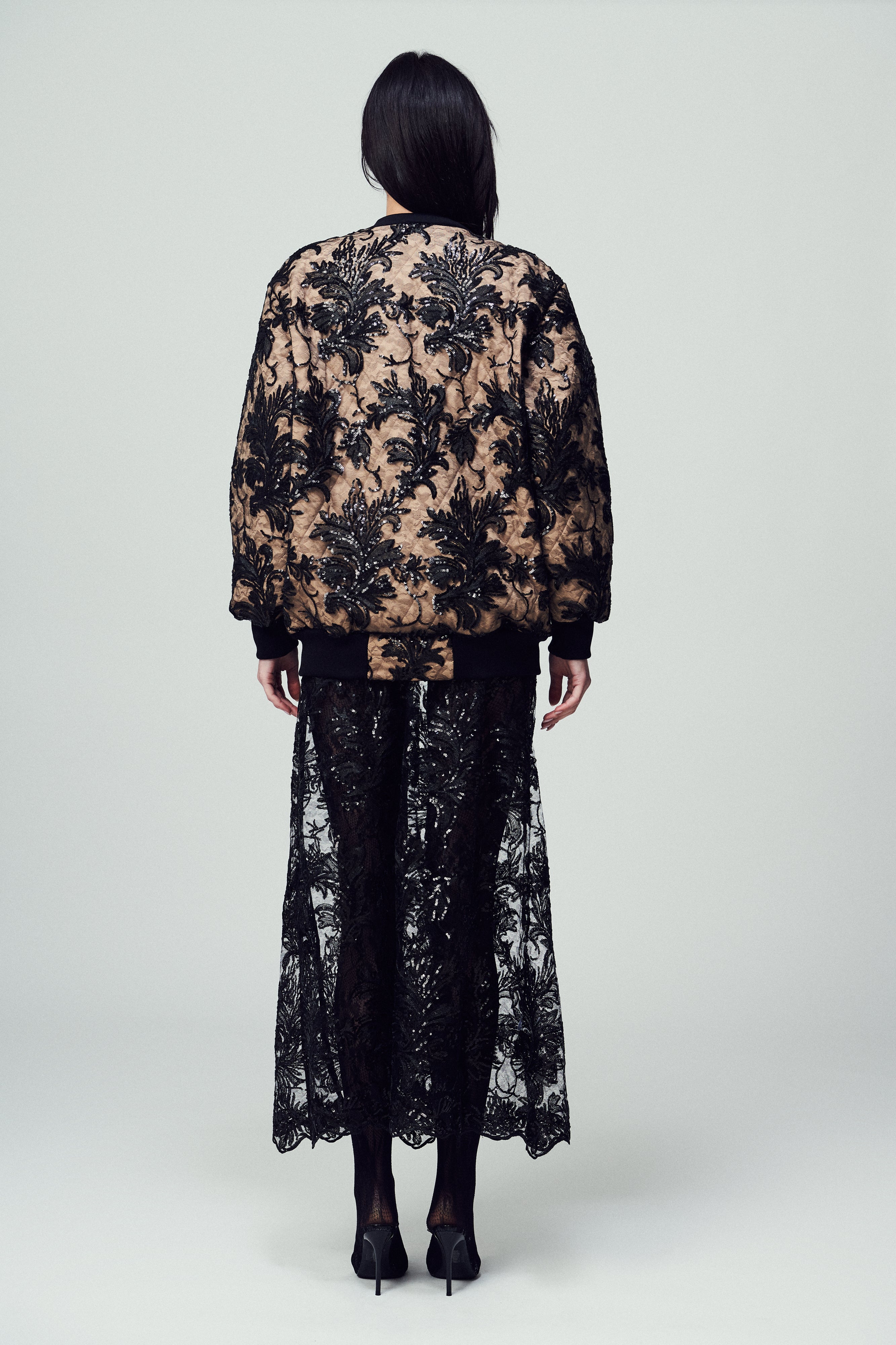Bomber Belluno in paillettes e pizzo nero con base beige